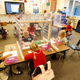 Kindergarten students work behind shields at their table at Freedom Preparatory Academy on September 10, 2020 in Provo, Utah.